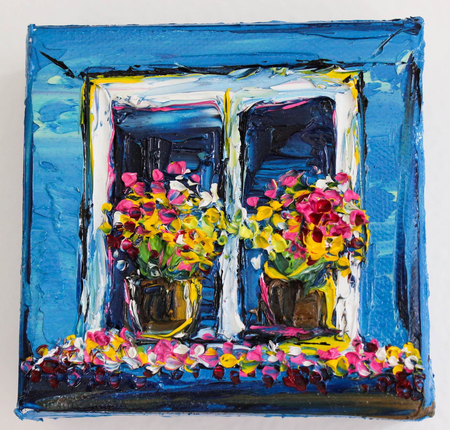 Little window with two flower pots